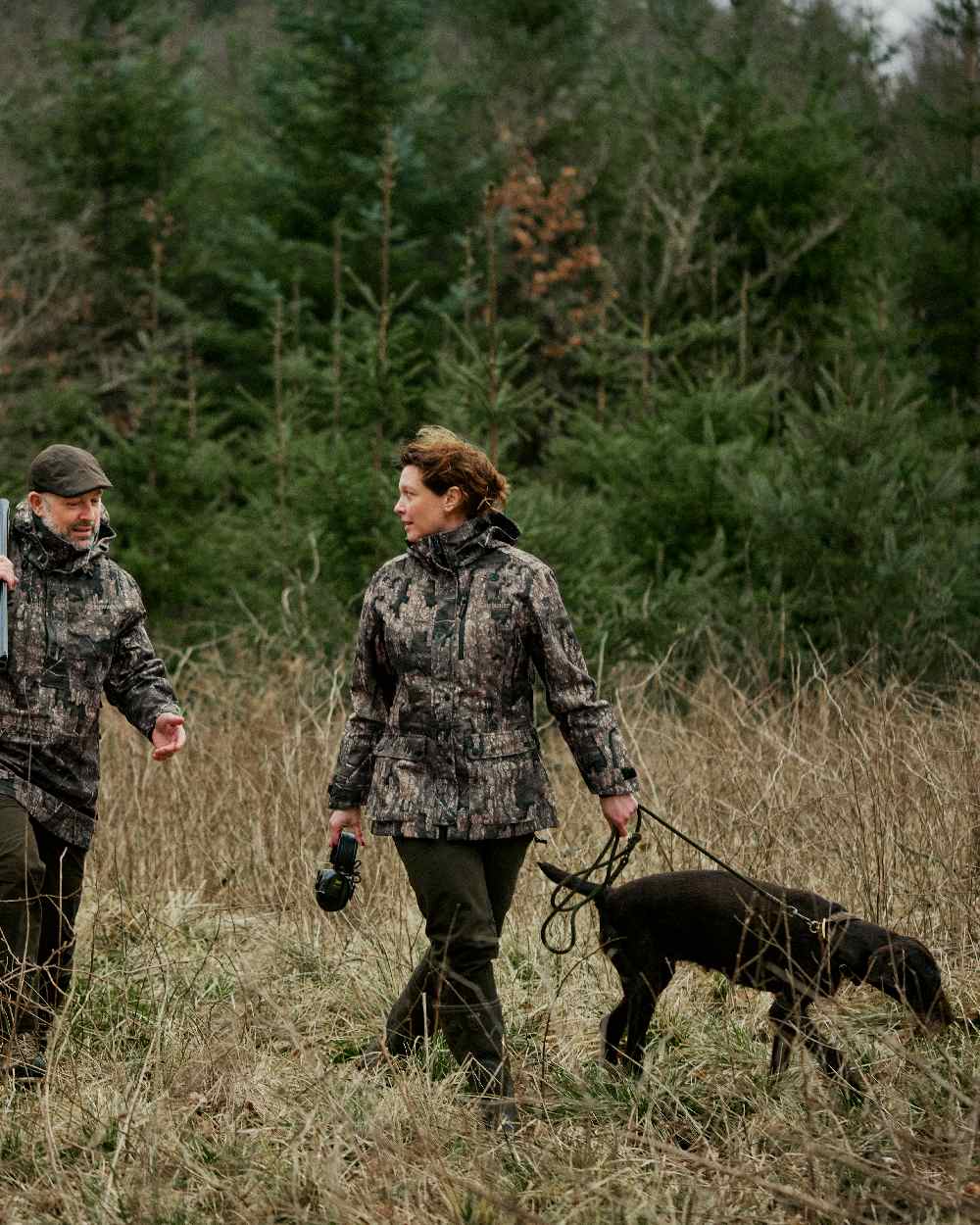 Peat coloured Deerhunter Lady Gabby Waterproof Boot Trousers on forest background 