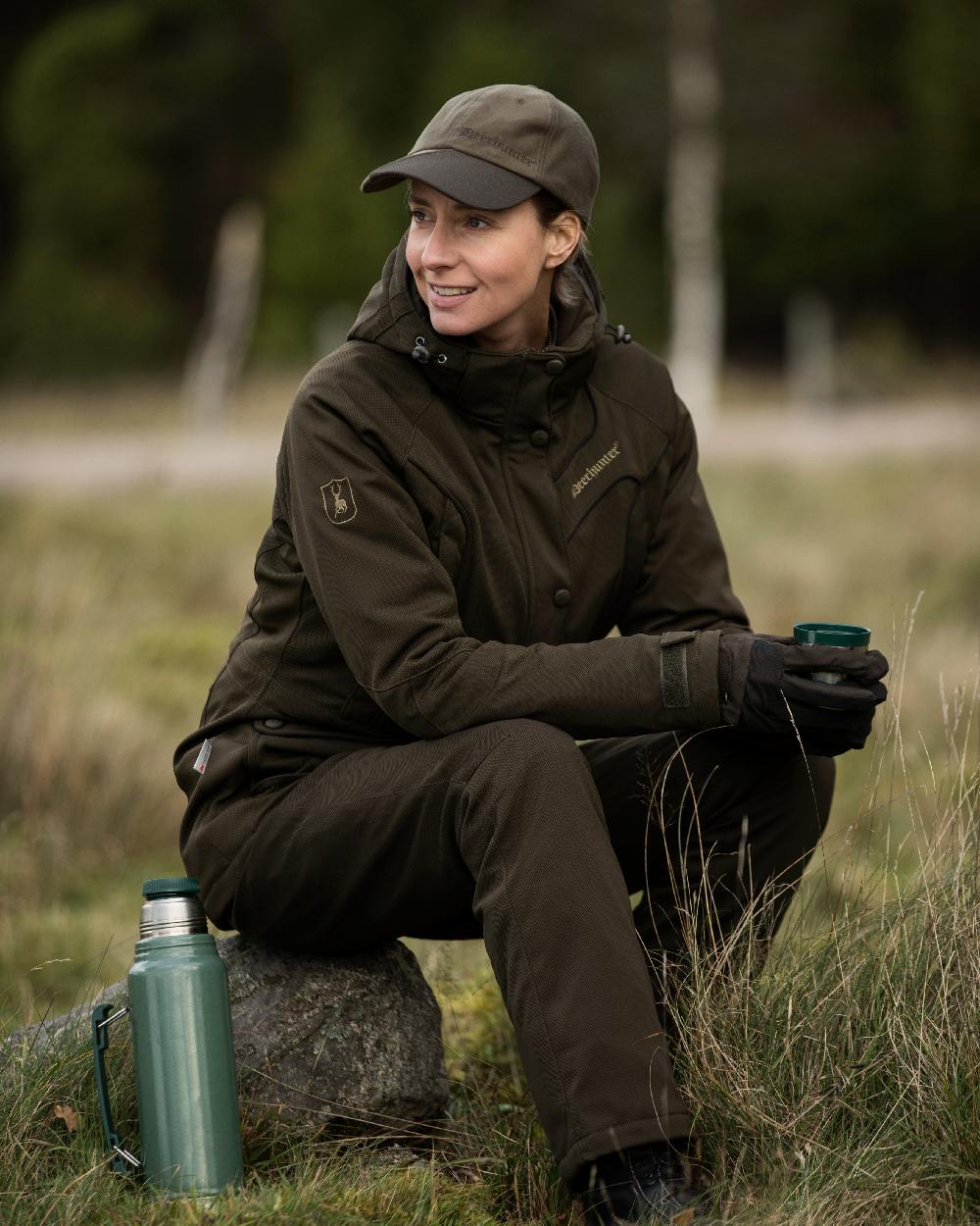 Art Green Coloured Deerhunter Lady Mary Jacket on blurry background 