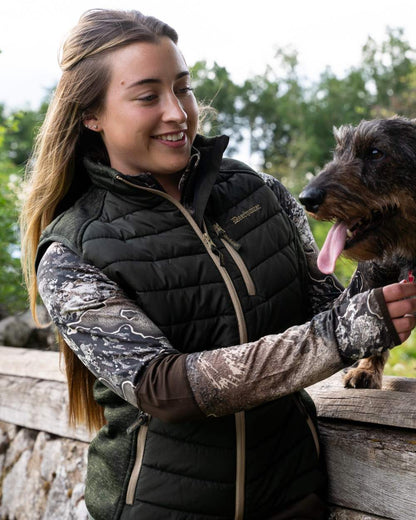 Forest Ember coloured Deerhunter Lady Moor Padded Waistcoat on forest background 