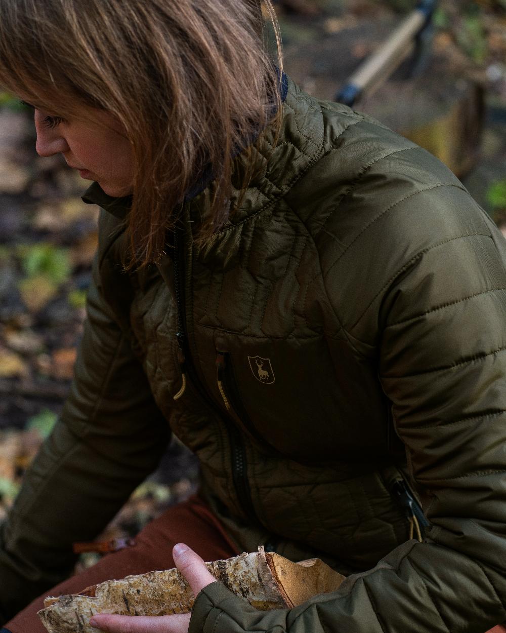 Forest Green coloured Deerhunter Lady Mossdale Quilted Jacket on forest background 
