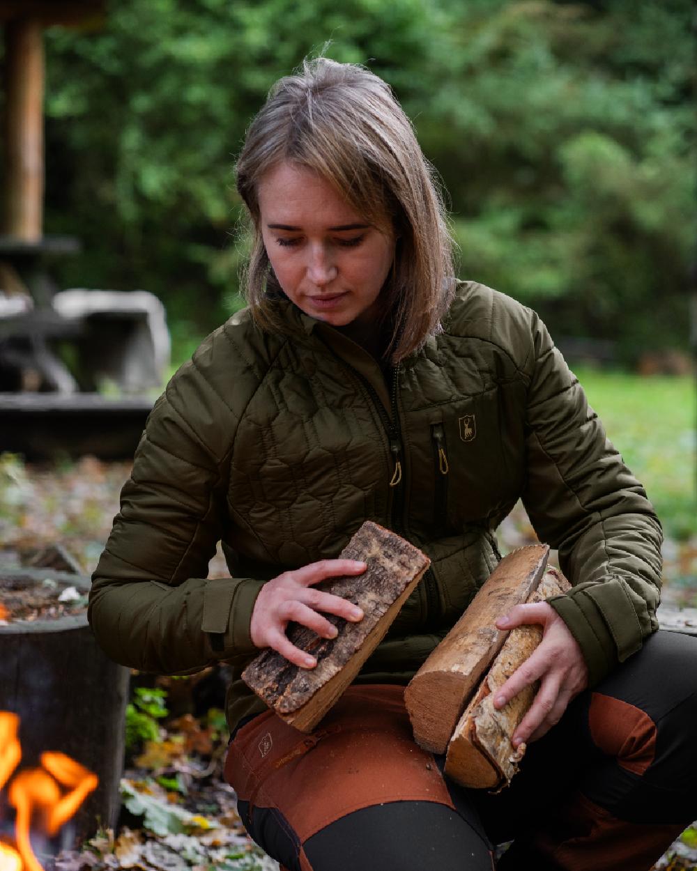 Forest Green coloured Deerhunter Lady Mossdale Quilted Jacket on forest background 