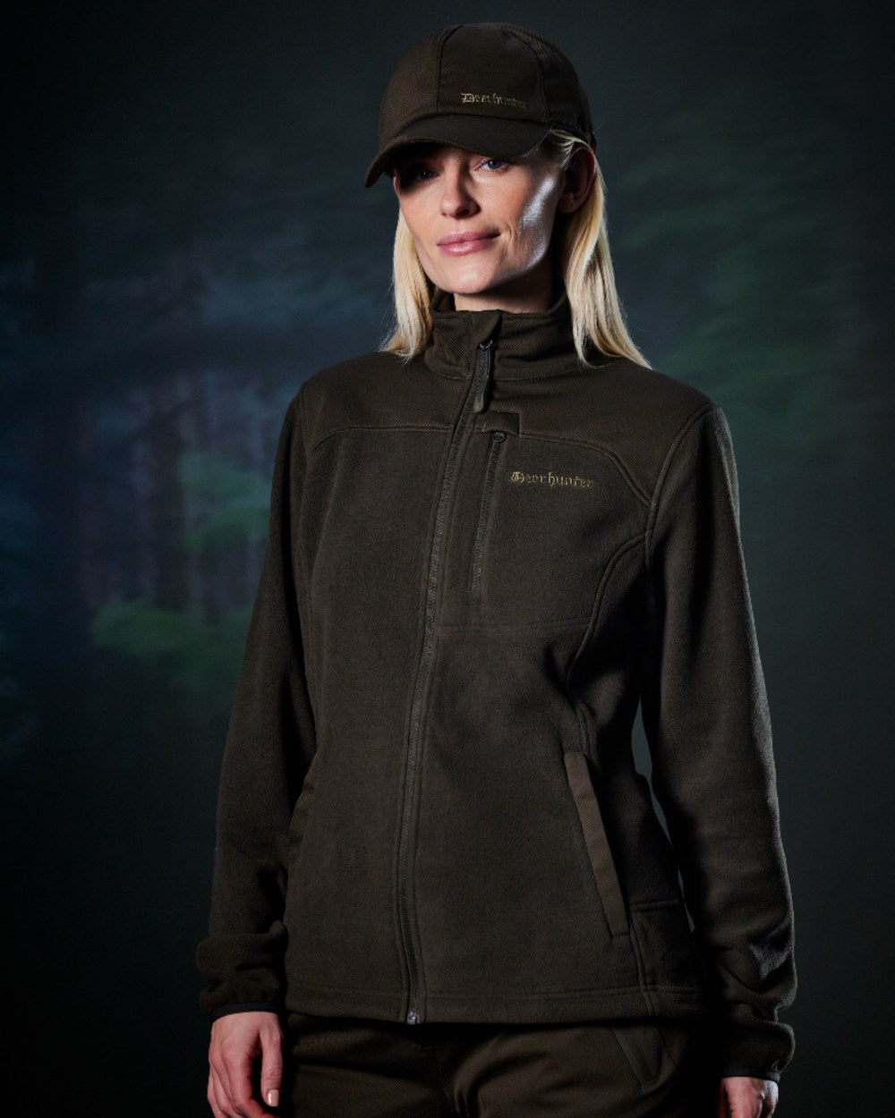 Art Green coloured Deerhunter Lady Muflon Pro Fleece Jacket on forest background 