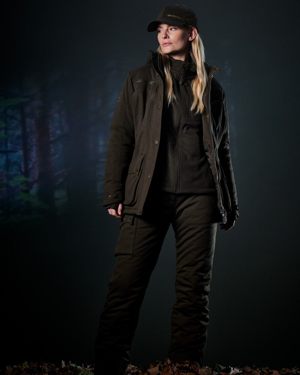 Art Green coloured Deerhunter Lady Muflon Pro Fleece Jacket on forest background 