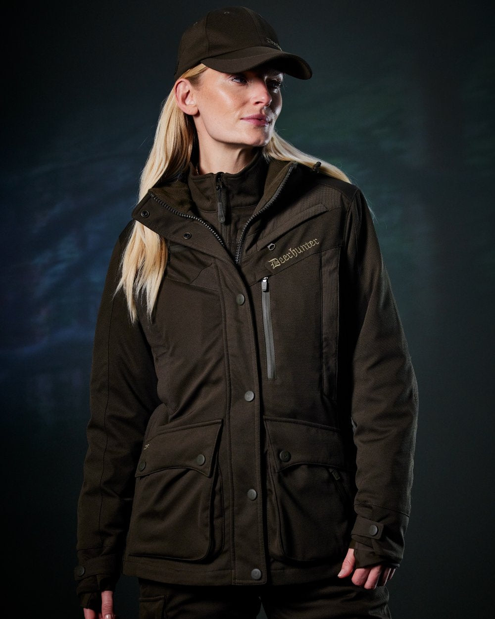 Art Green coloured Deerhunter Lady Muflon Pro Jacket on forest background 