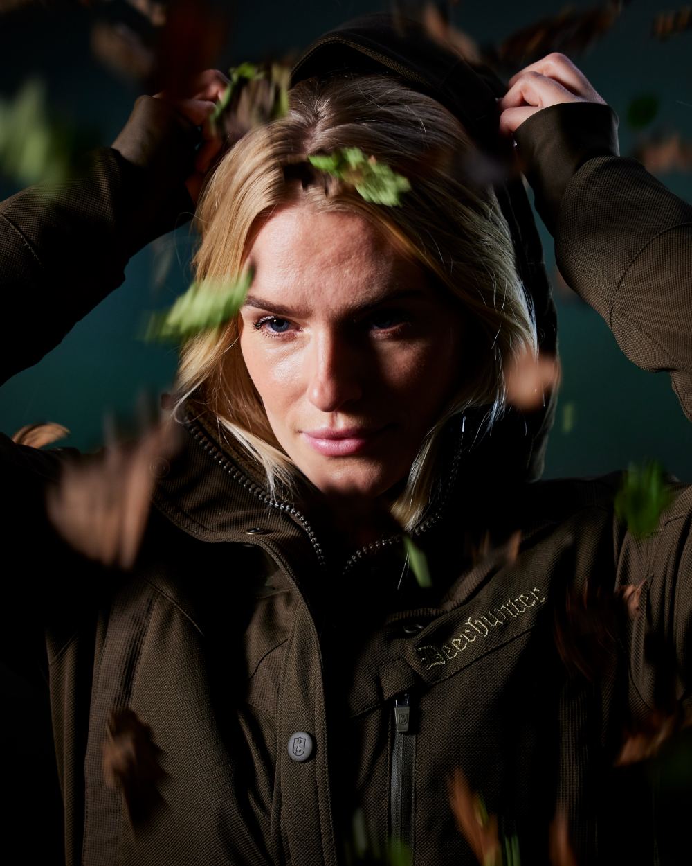 Art Green coloured Deerhunter Lady Muflon Pro Jacket on forest background 