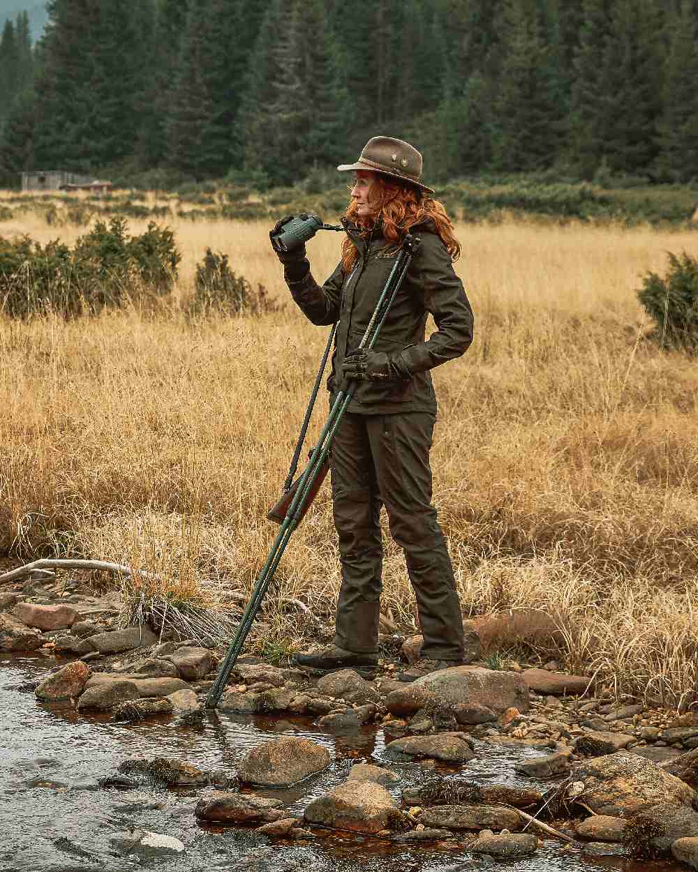 Elmwood coloured Deerhunter Lady Raven Winter Trousers on grassy background 