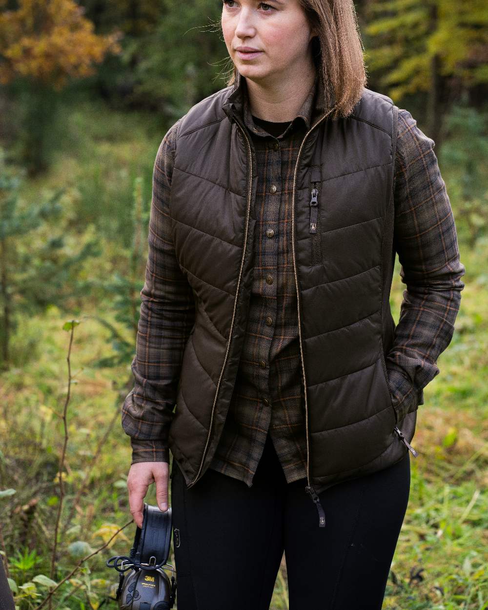 Black coloured Deerhunter Lady Reinforced Tights on grassy background 