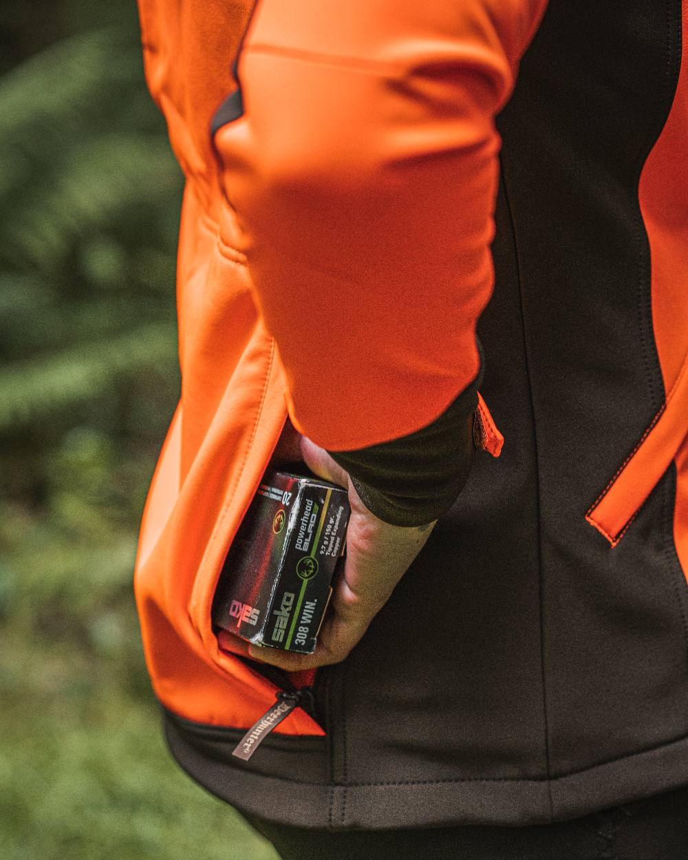 Orange coloured Deerhunter Lady Roja Softshell Jacket on blurry background 