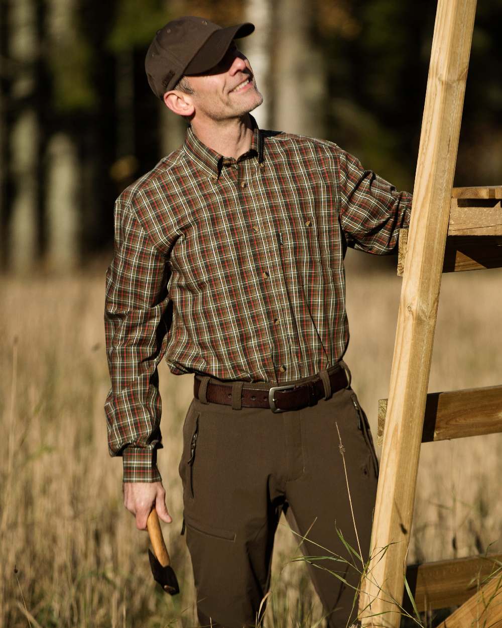 Dark Brown coloured Deerhunter Leather Belt on grassy background 