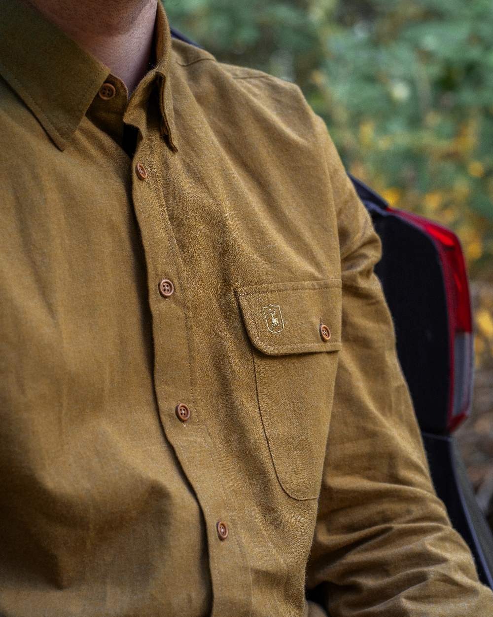Ocher Brown coloured Deerhunter Liam Cotton Shirt on blurry background 