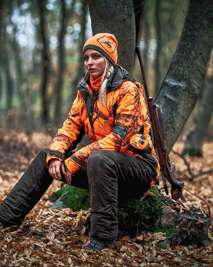 Orange coloured Deerhunter Logo Neck Tube on forest background 