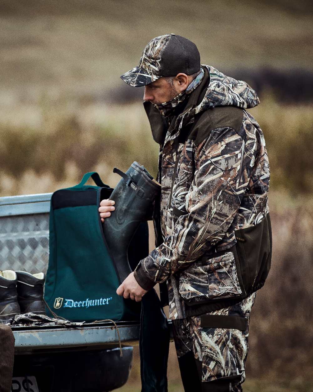 Realtree Max-5 coloured Deerhunter Mallard Trousers on blurry background 