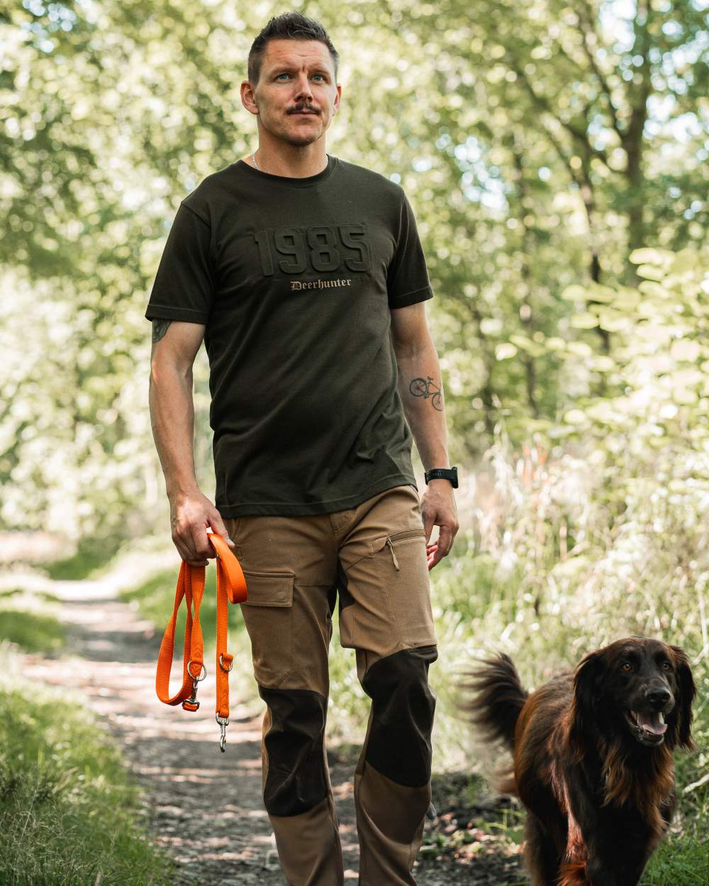 Timber coloured Deerhunter Mens Jubilee T-Shirt on forest background 
