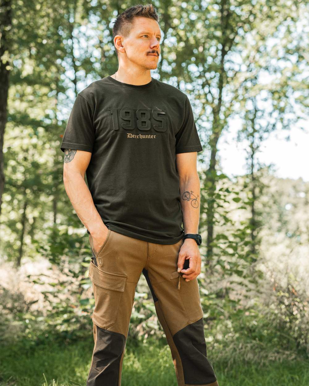 Timber coloured Deerhunter Mens Jubilee T-Shirt on forest background 