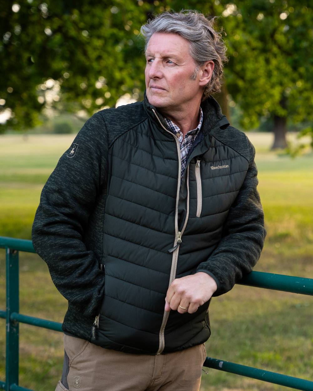 Forest Ember coloured Deerhunter Mens Moor Padded Jacket on forest background 