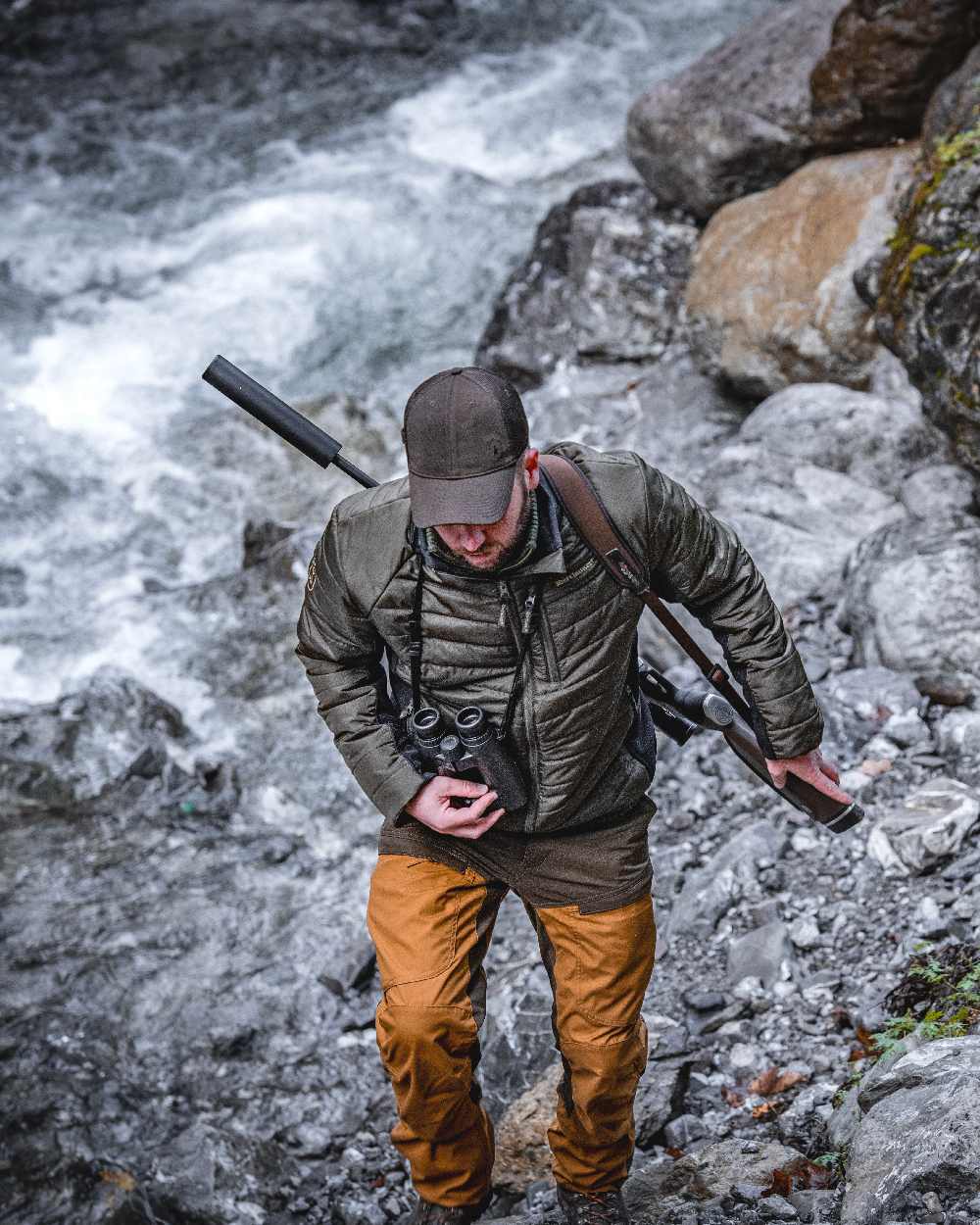 Adventure Green coloured Deerhunter Moor Padded Softshell Jacket on lake background 