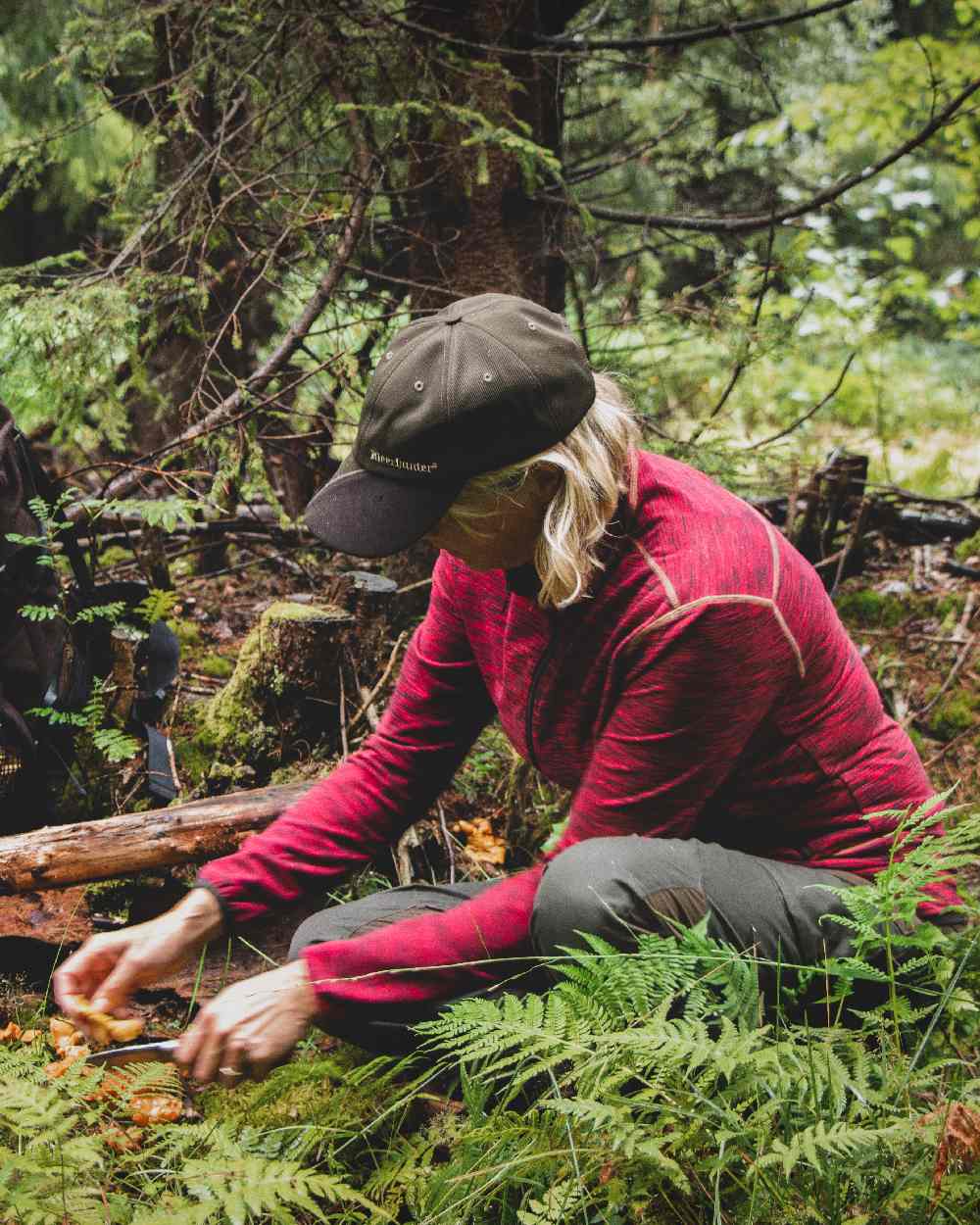 Art Green coloured Deerhunter Muflon Cap on forest background 