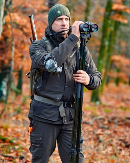 Wood Coloured Deerhunter Muflon Extreme Waterproof Jacket on forest background 