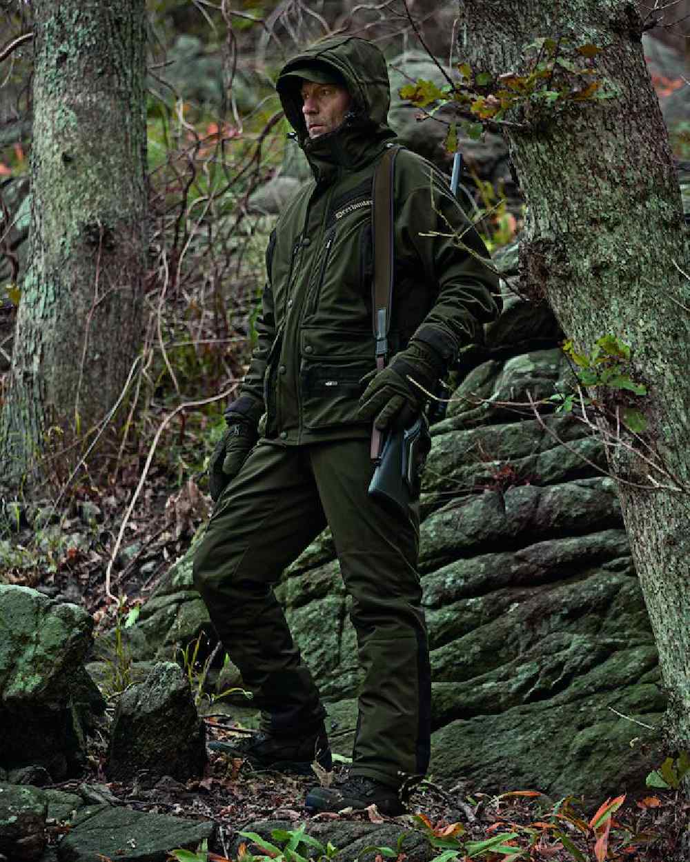 Art Green Coloured Deerhunter Muflon Jacket - Long on forest background 