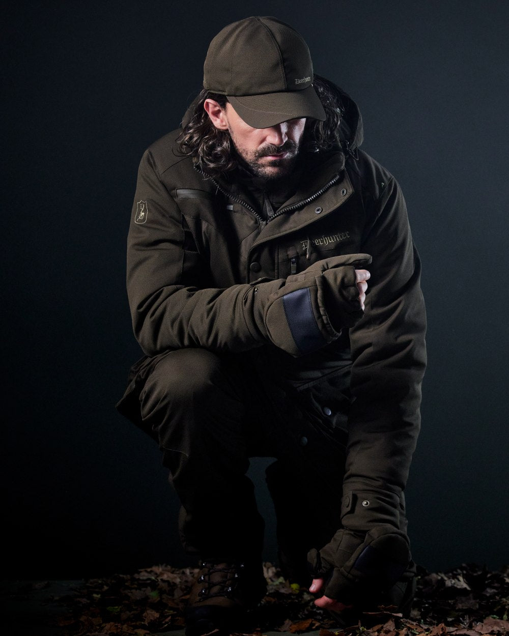 Art Green coloured Deerhunter Mens Muflon Pro Glomitts on forest background 