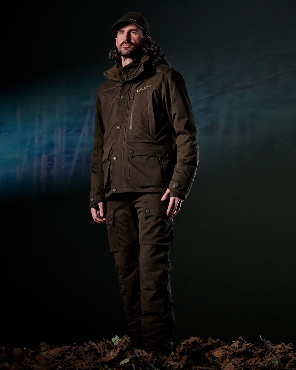 Art Green coloured Deerhunter Mens Muflon Pro Jacket on forest background 