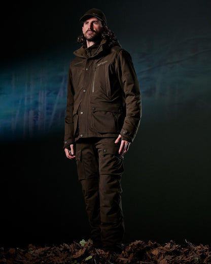 Art Green coloured Deerhunter Mens Muflon Pro Jacket on forest background 