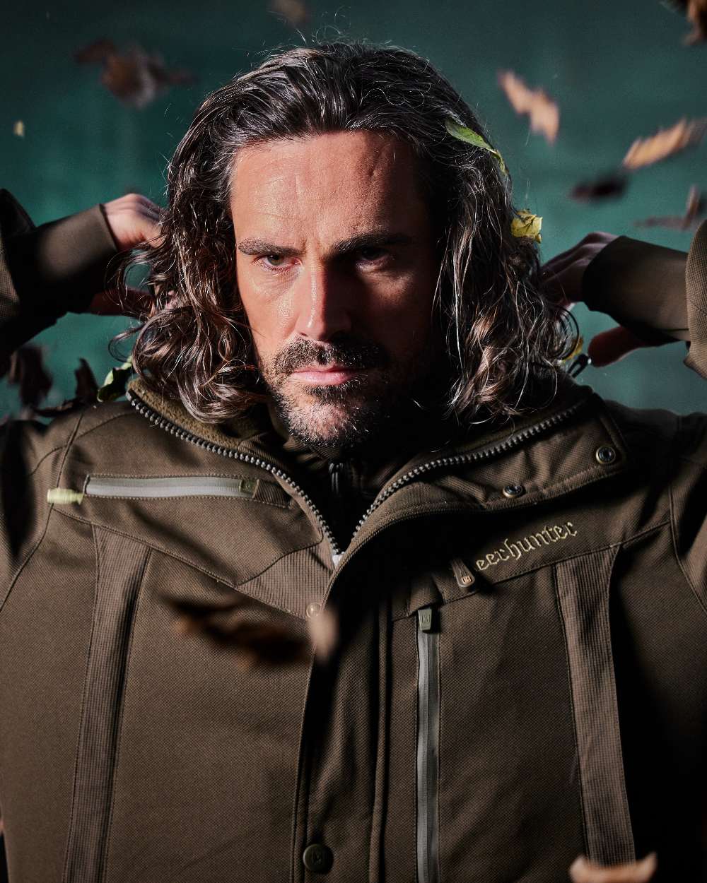 Art Green coloured Deerhunter Mens Muflon Pro Jacket on forest background 