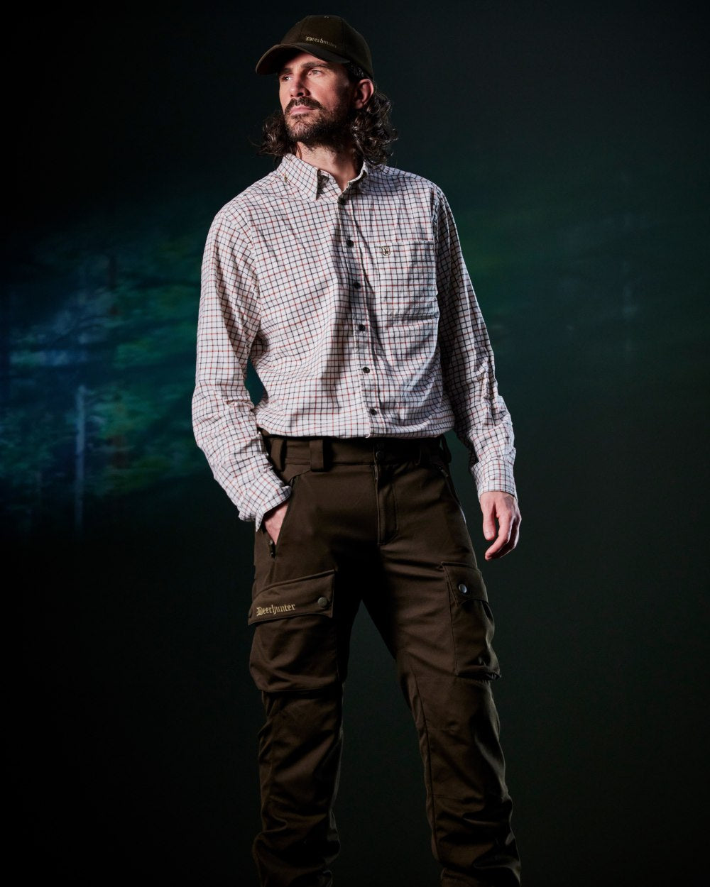 Art Green coloured Deerhunter Mens Muflon Pro Light Trousers on forest background 