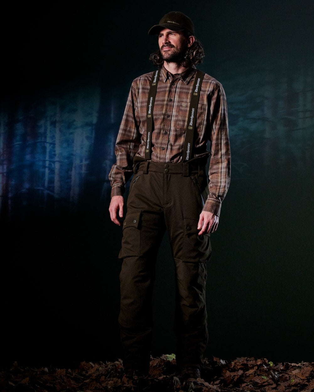 Art Green coloured Deerhunter Mens Muflon Pro Trousers on forest background 