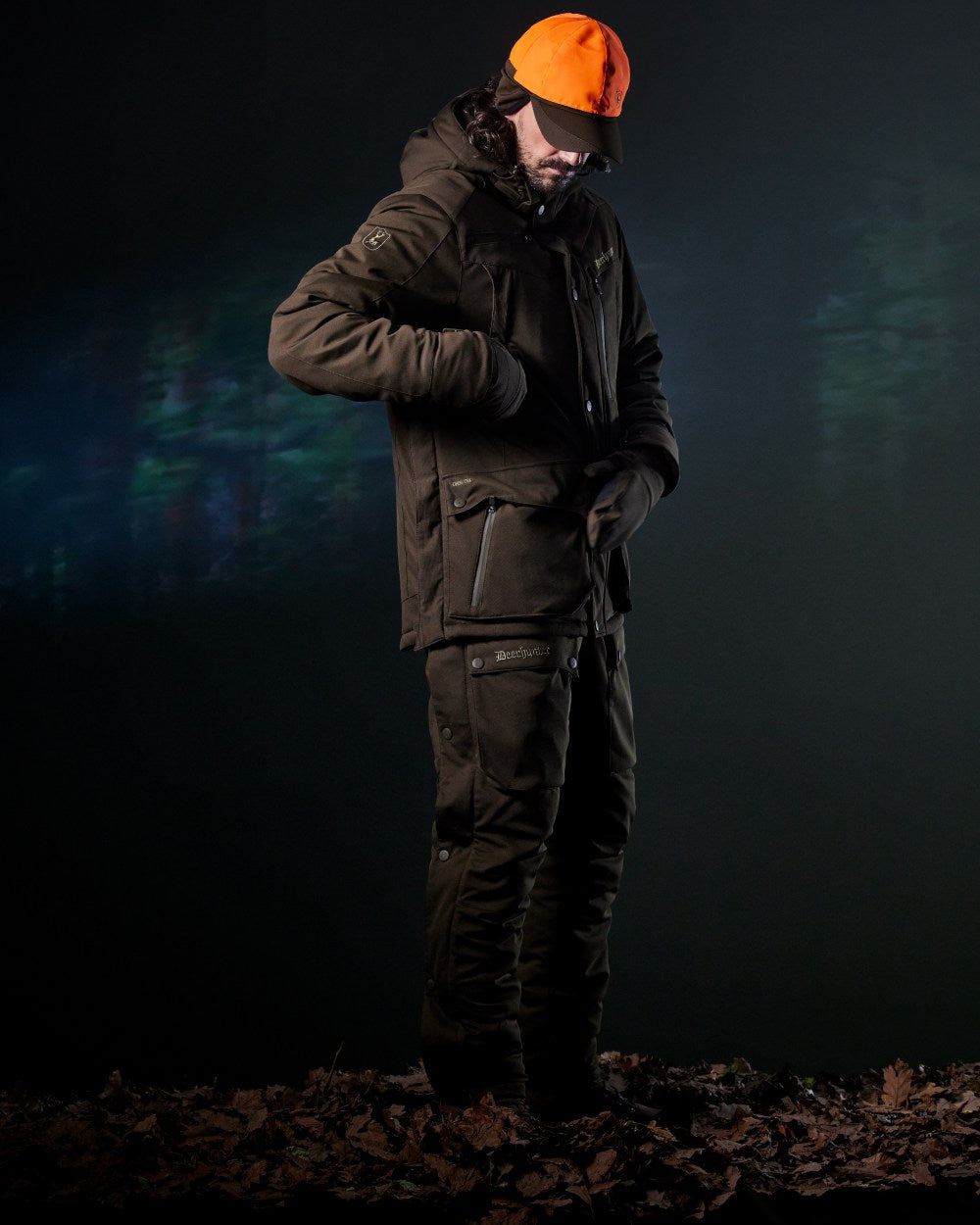 Art Green coloured Deerhunter Mens Muflon Pro Winter Jacket on forest background 