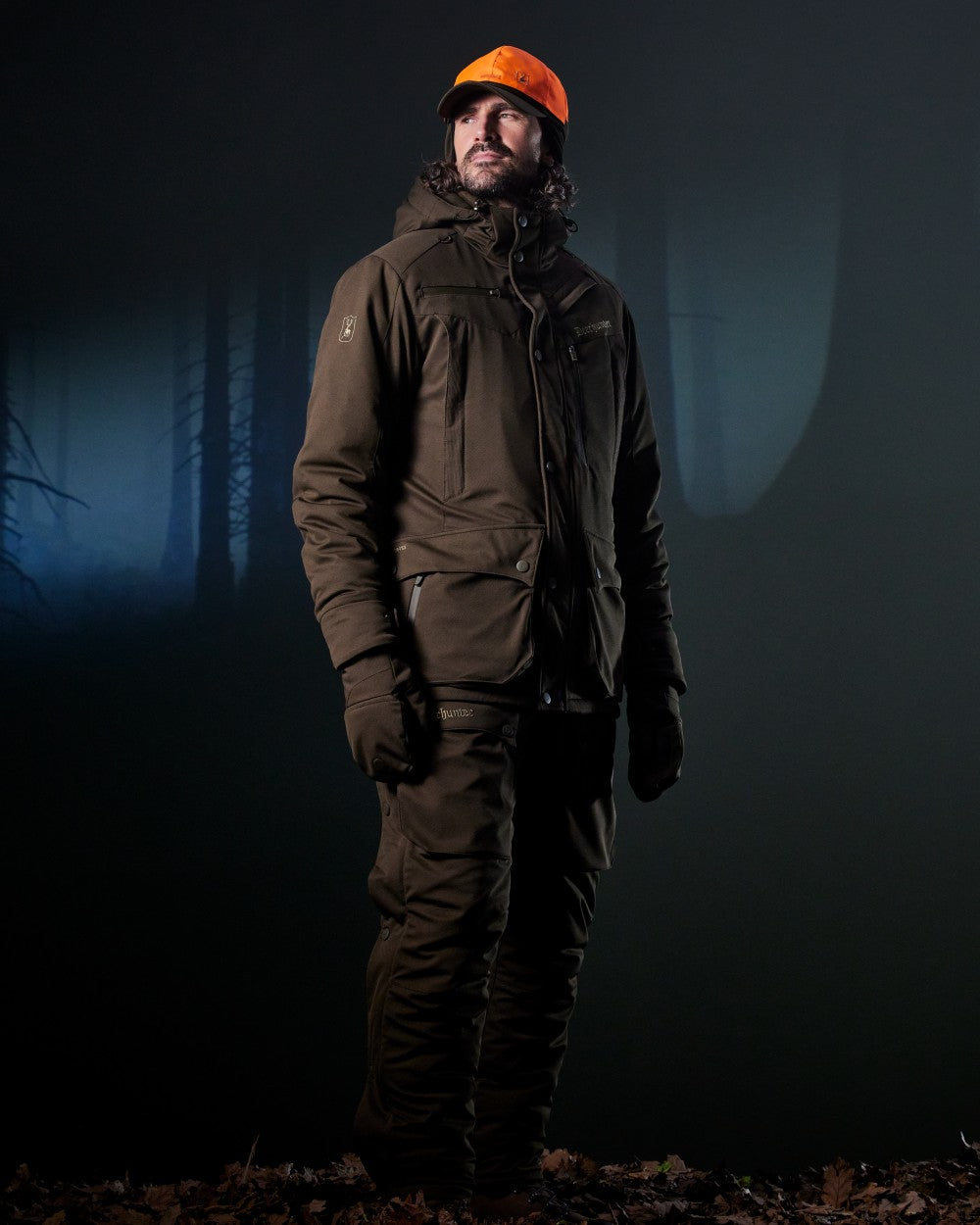 Art Green coloured Deerhunter Mens Muflon Pro Winter Jacket on forest background 
