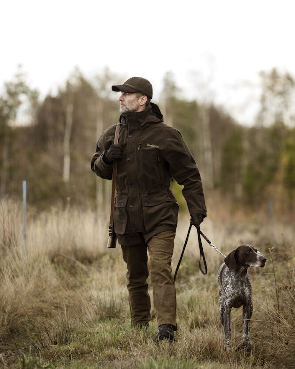Peat Coloured Deerhunter PRO Gamekeeper Jacket on forest background 