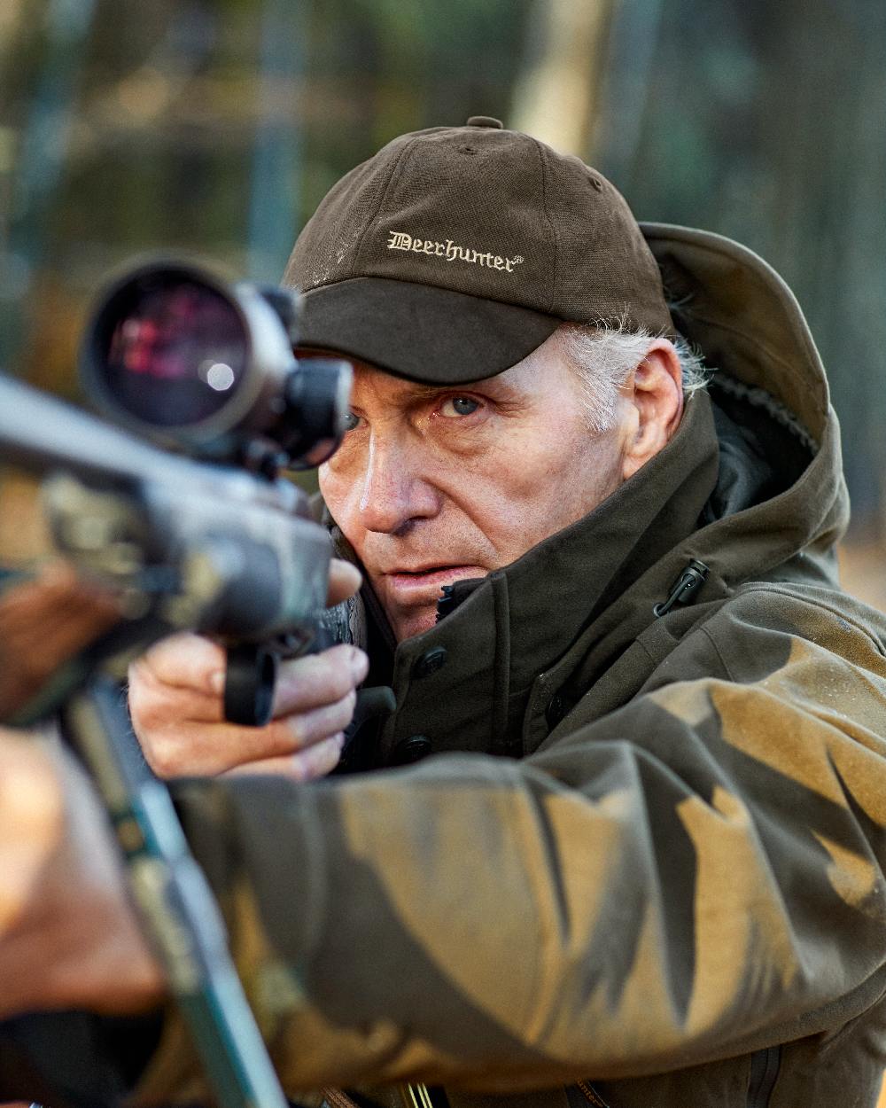 Peat Coloured Deerhunter PRO Gamekeeper Jacket on blurry background 