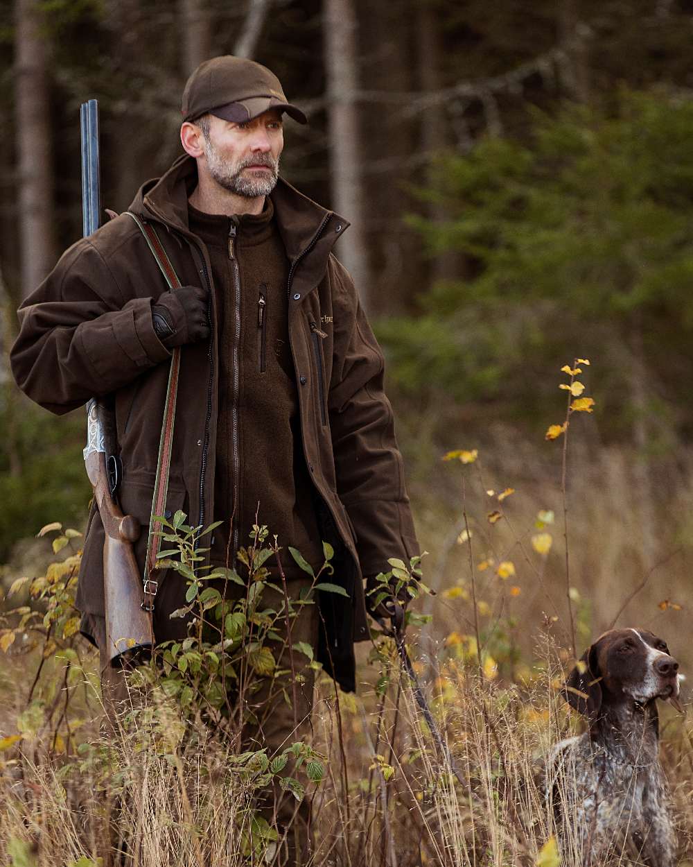 Peat Coloured Deerhunter PRO Gamekeeper Jacket on forest background 