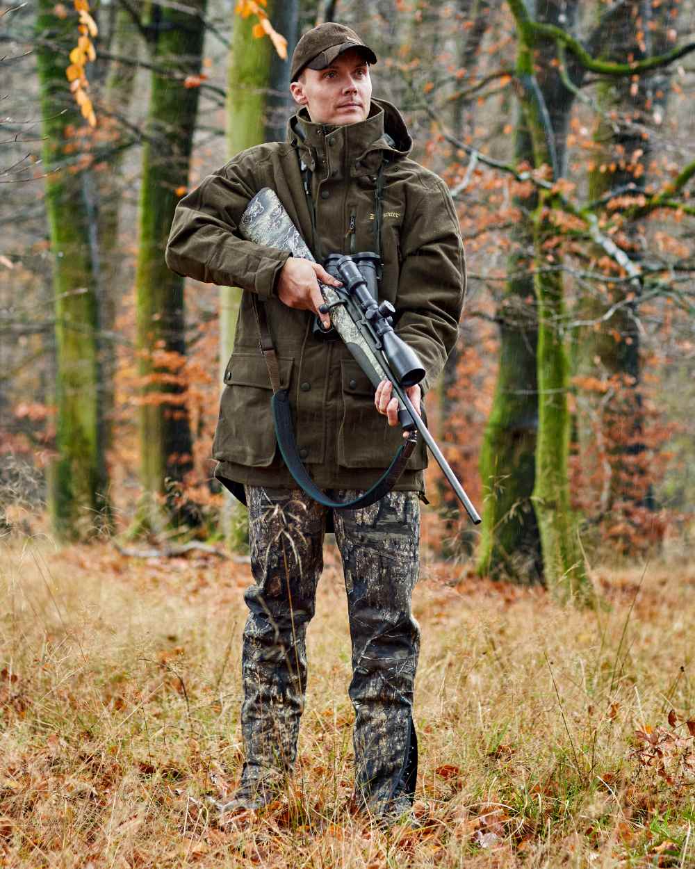 Peat Coloured Deerhunter Pro Gamekeeper Boot Trousers on forest background 