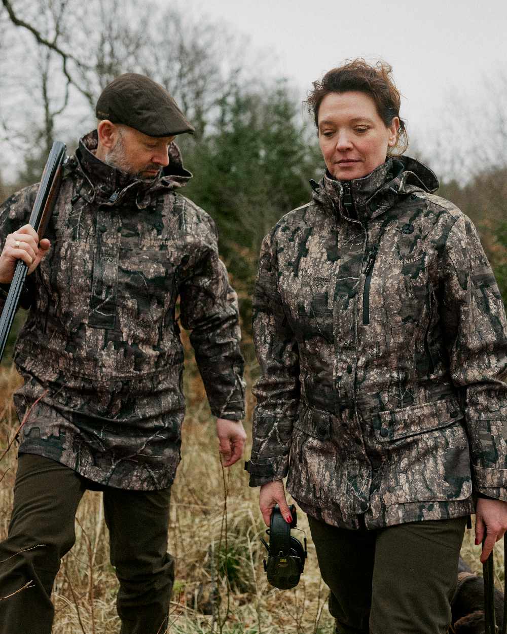 Peat coloured Deerhunter Pro Gamekeeper Flatcap on forest background 