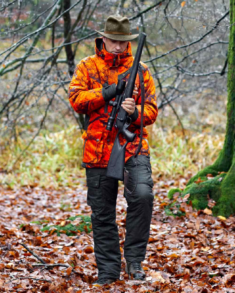 Realtree Edge Orange coloured Deerhunter Ram Arctic Jacket on forest background 