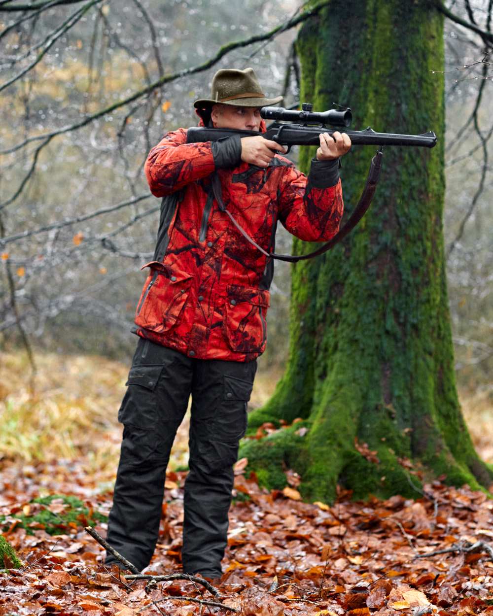 Realtree Edge Red coloured Deerhunter Ram Arctic Jacket on forest background 