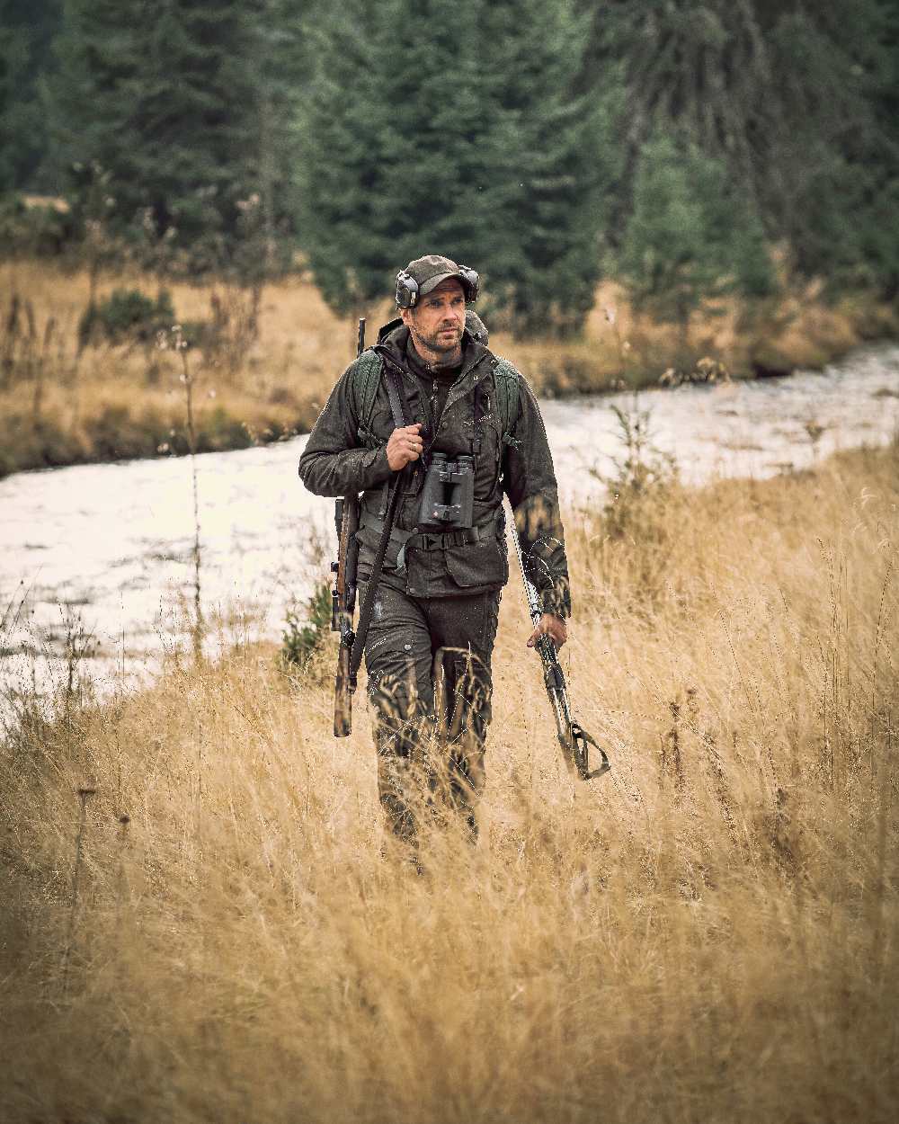 Elmwood coloured Deerhunter Ram Winter Trousers on grassy background 