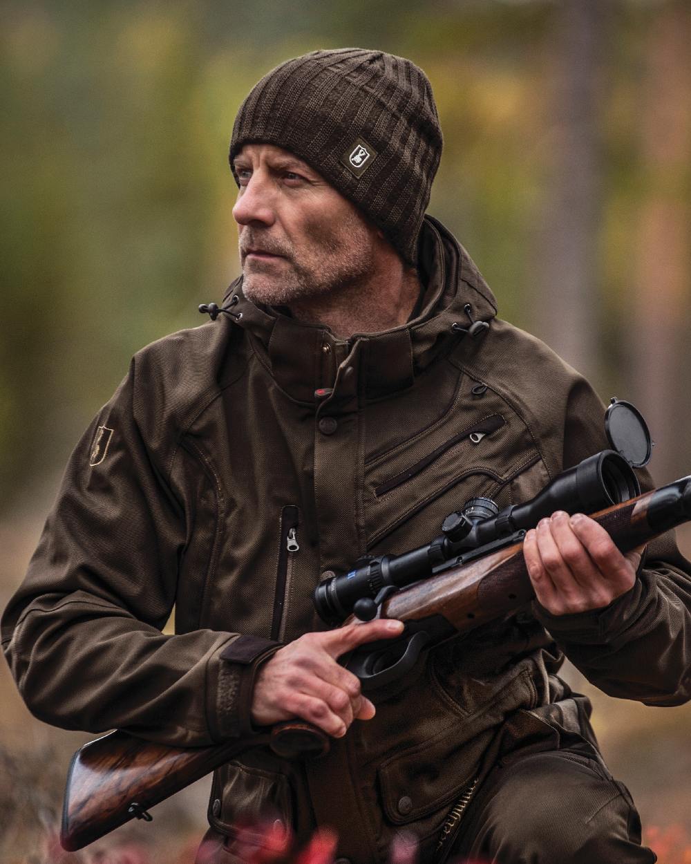 Beluga coloured Deerhunter Recon Knitted Beanie on forest background 