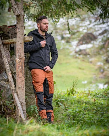 Burnt Orange Coloured Deerhunter Rogaland Contrast Stretch Trousers on forest background 