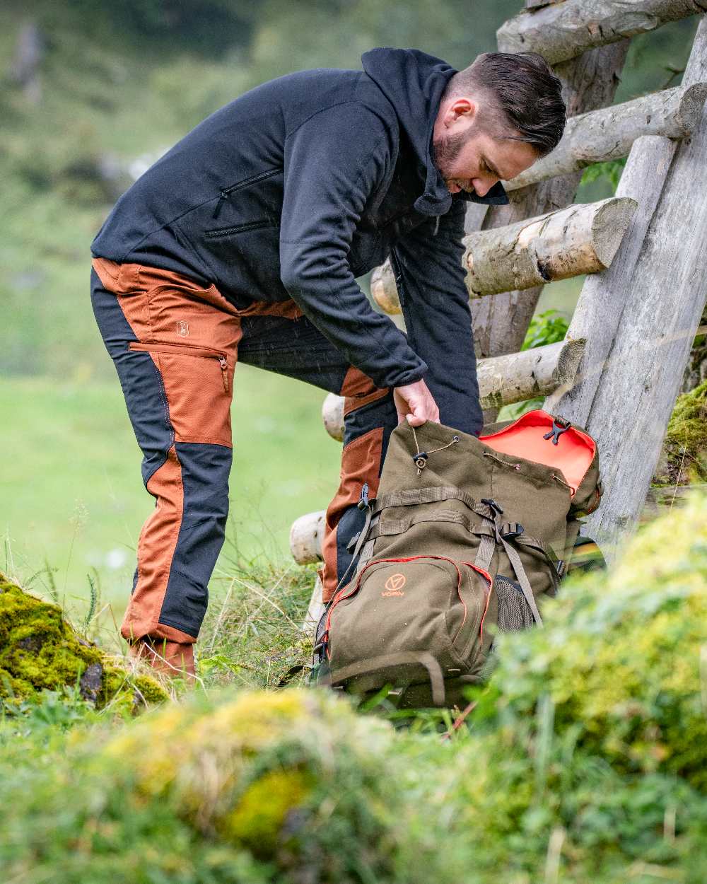 Burnt Orange Coloured Deerhunter Rogaland Contrast Stretch Trousers on forest background 