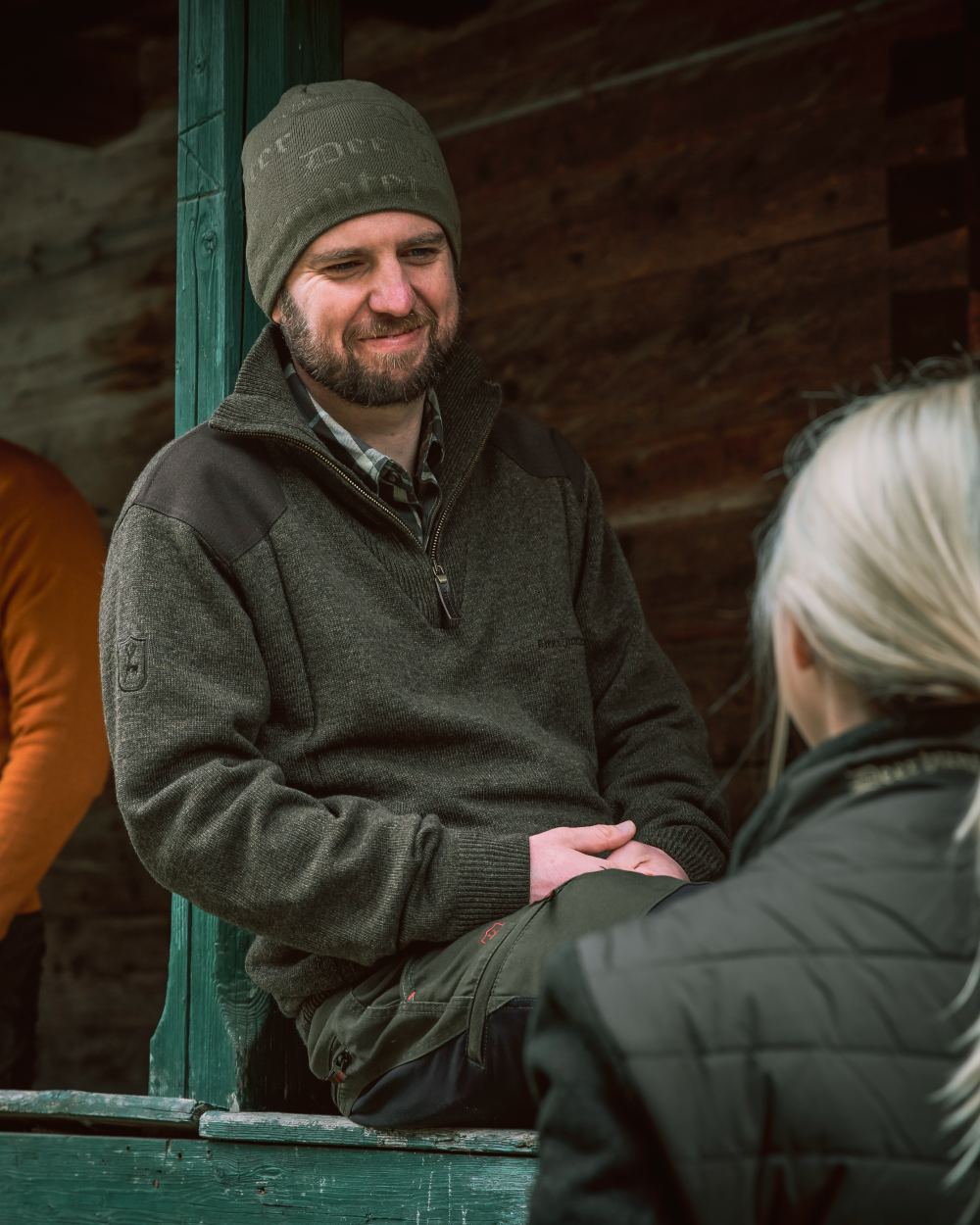 Dark Elm coloured Deerhunter Sheffield Zip Neck Sweater on house background 