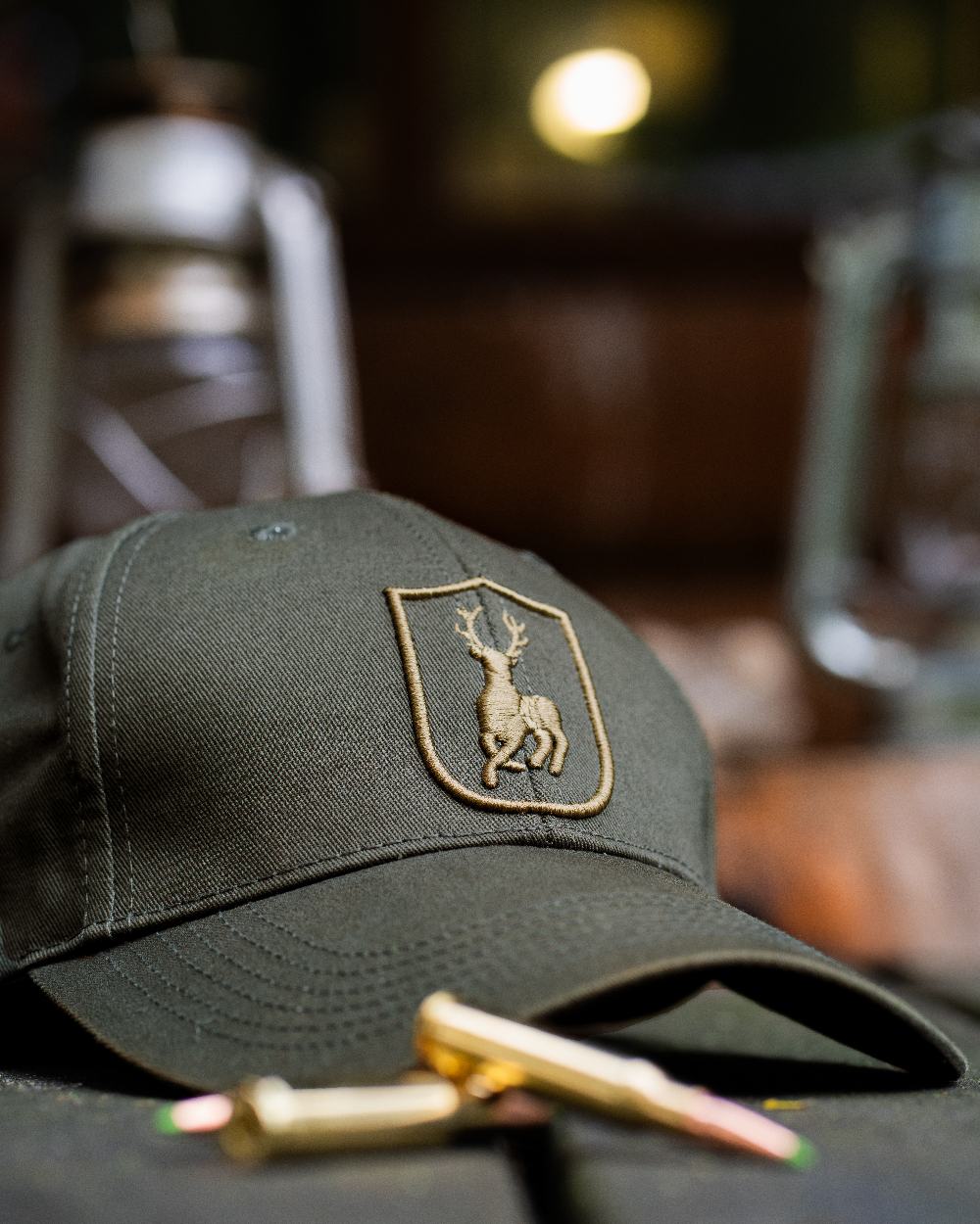 Timber coloured Deerhunter Shield Cap on blurry background 