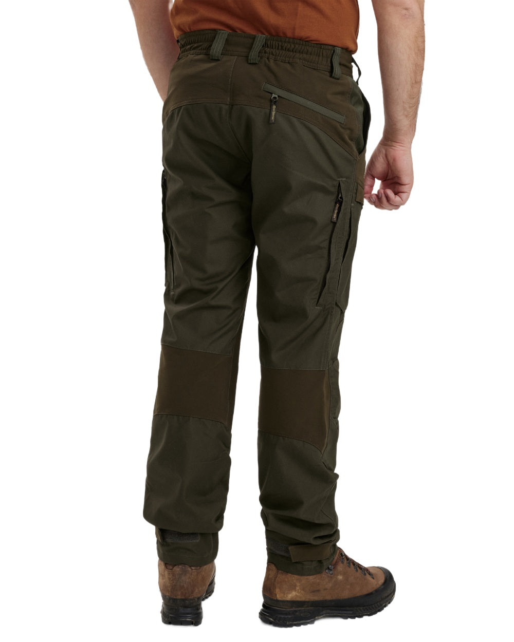 Deep Green coloured Deerhunter Strike Trousers With Membrane on forest background 