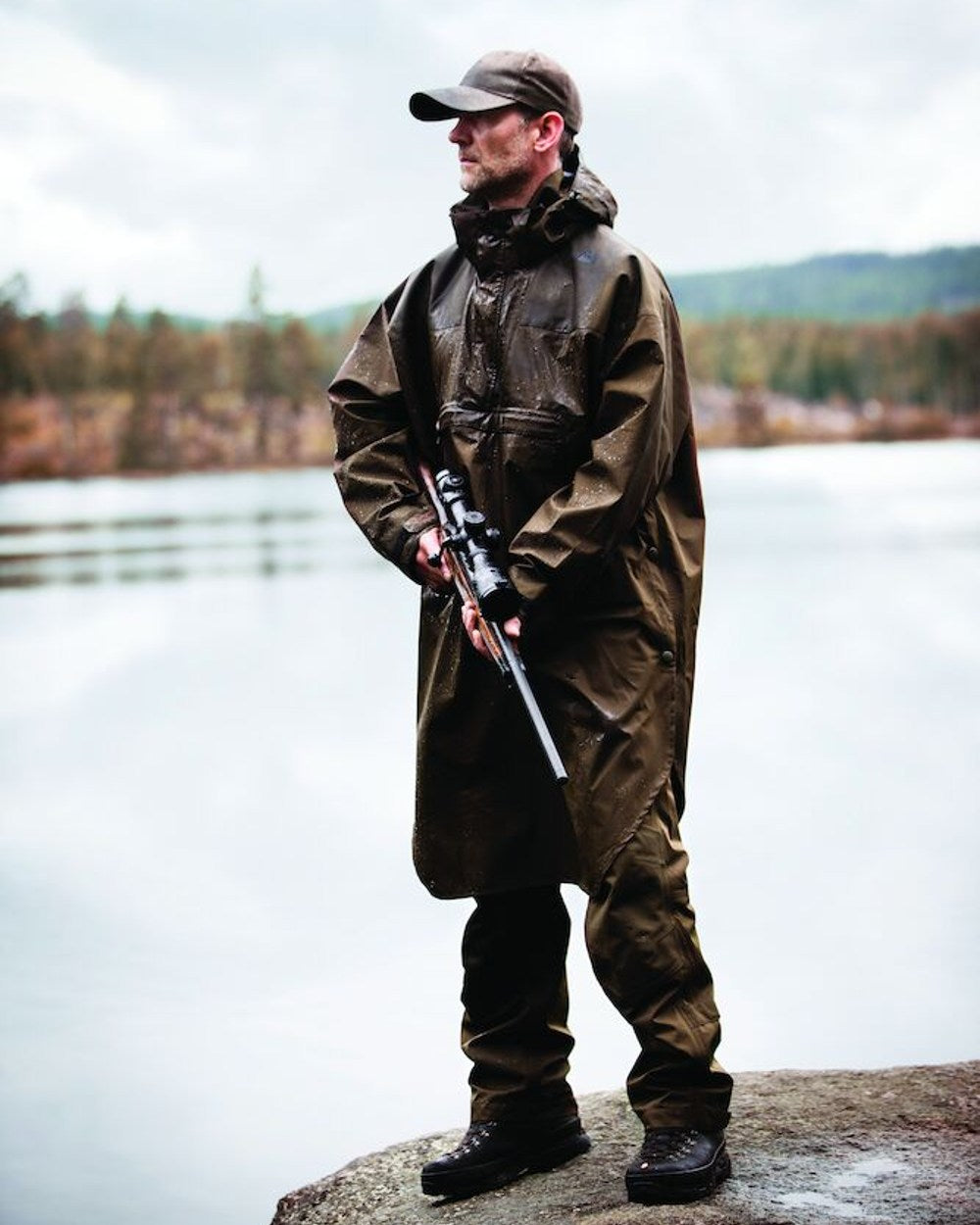 Canteen Coloured Deerhunter Track Rain Long Anorak on lake background 