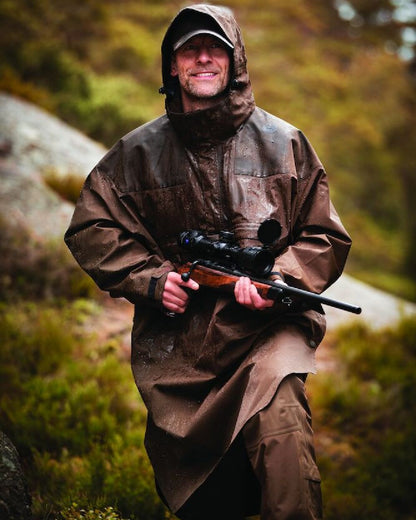 Canteen Coloured Deerhunter Track Rain Long Anorak on mountain background 