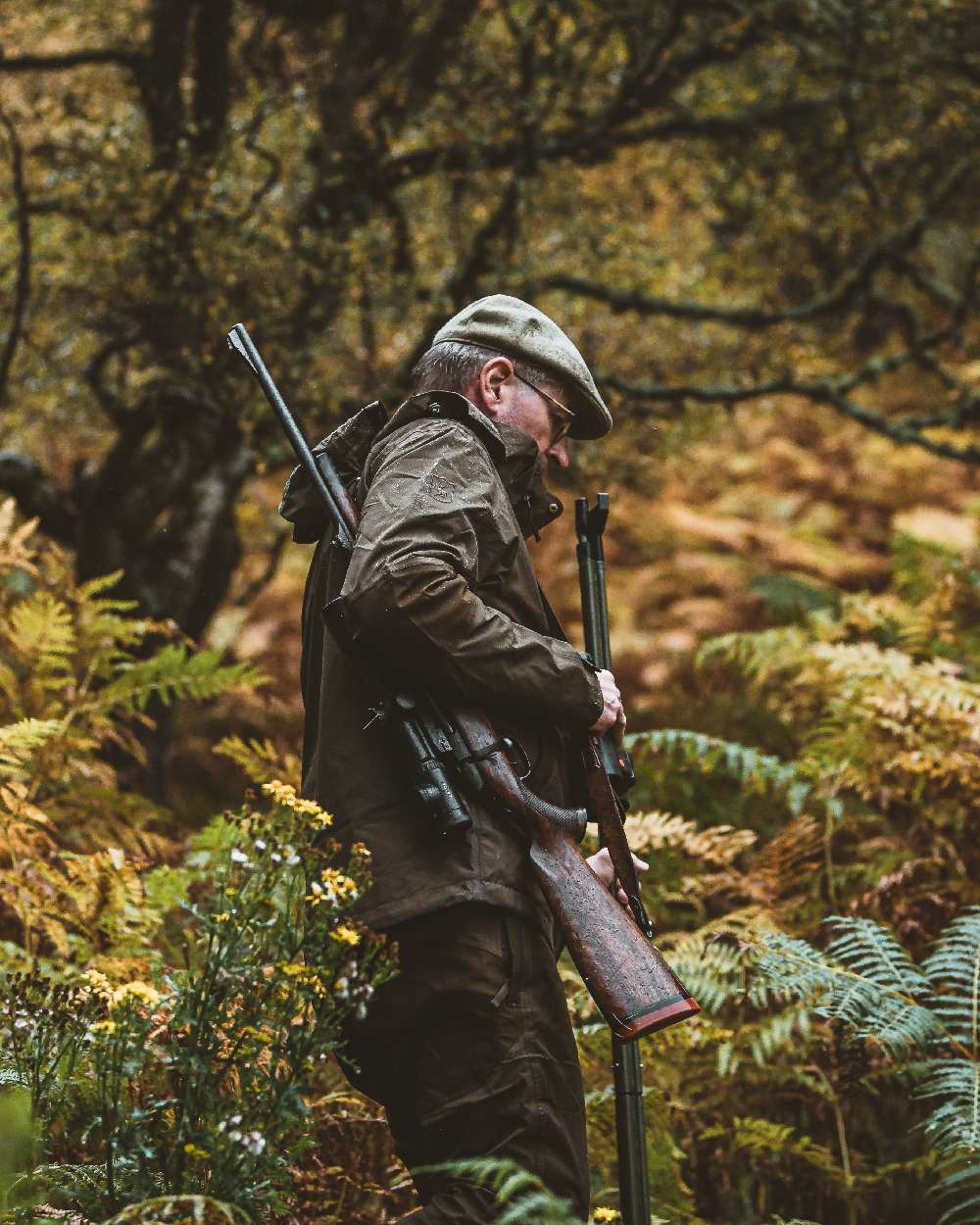 Canteen coloured Deerhunter Track Rain Trousers on forest background 
