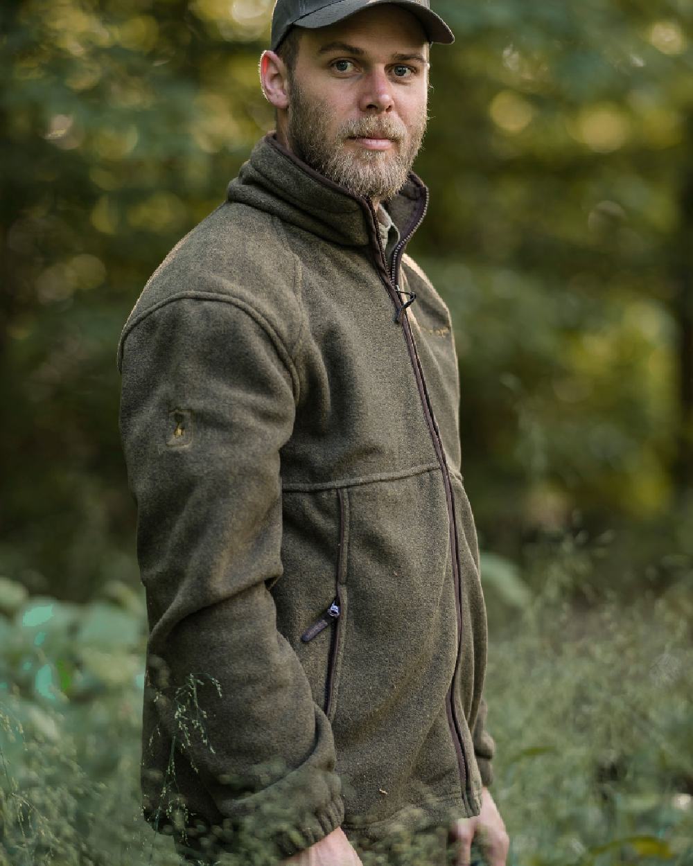 Graphite Green coloured Deerhunter Wingshooter Fleece Jacket on forest background 