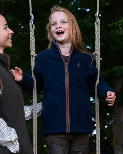 Dark Blue Coloured Deerhunter Youth Cumbria Fleece Jacket on forest background 